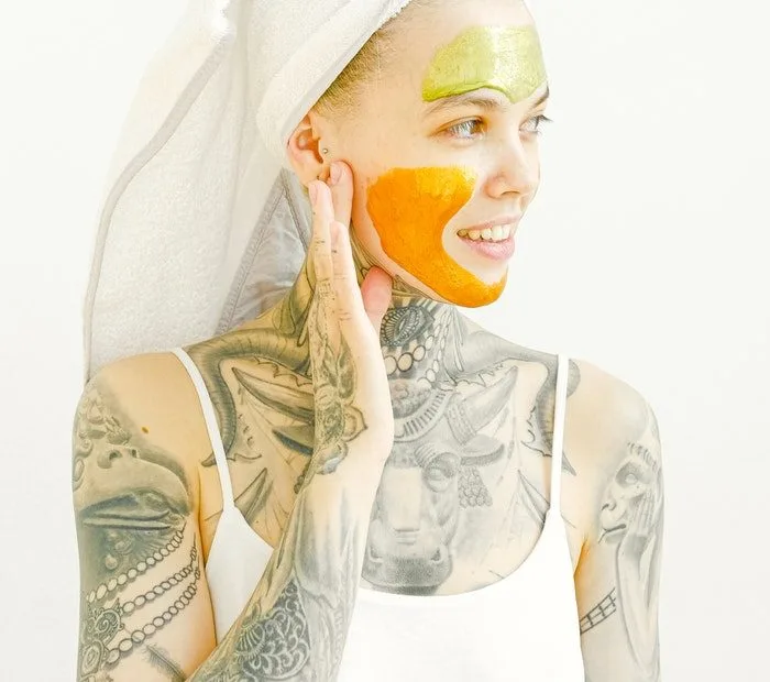 Woman applying face cream